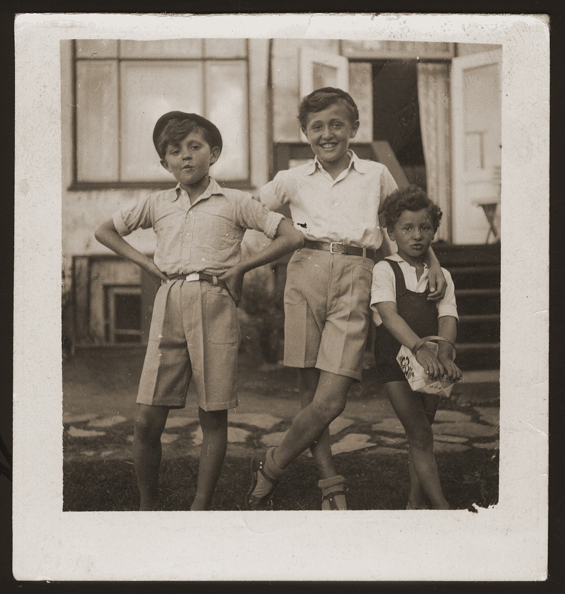 Milan, Leo and Gus Goldberger in front of their family's summer h