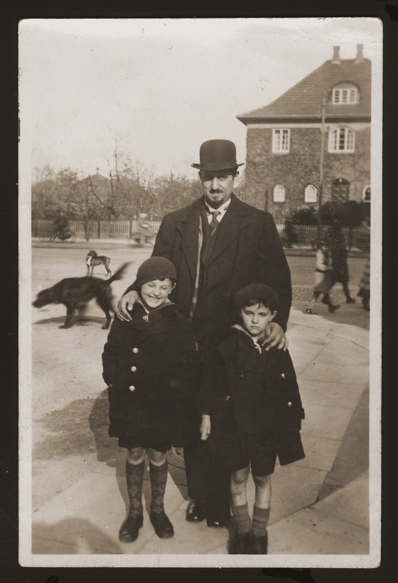 Cantor Eugene Goldberger poses with his sons Milan and Leo, shortly af